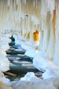 Winter scenery. Baltic Sea. Close up ice formations icicles on pier poles Royalty Free Stock Photo