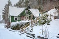 Winter scenery with green wooden house in Sweden Royalty Free Stock Photo