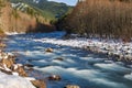 Winter scenery of ice and snow along the White River under Mount Rainier.