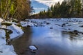 Winter scenery of ice and snow along the White River under Mount Rainier.