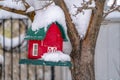 Winter scenery with miniature house on a tree Royalty Free Stock Photo