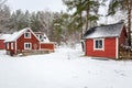 Winter scenery with red wooden house in Sweden Royalty Free Stock Photo