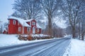 Winter scenery with red wooden house