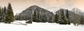 Winter scenic view of Alpine huts and forest in the Alps near Antholz Lake, Italian Alps, South Tirol. Royalty Free Stock Photo