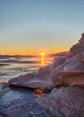 Winter sea sunset. Panoramic view of the snow-covered shore of the frozen sea, the lake at sunset. Shards of ice close-up. Royalty Free Stock Photo