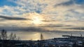 Winter sea sunset. Panoramic view of the snow-covered shore of the frozen sea, the lake at sunset. Shards of ice close-up. Royalty Free Stock Photo