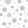 Winter seamless pattern with cartoon hand drawn snowflakes on white background Royalty Free Stock Photo