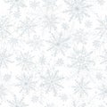 Winter seamless pattern with flat grey blue snowflakes and dots on white background.