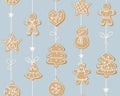 Winter seamless pattern. sweet cookies in the form of a man, Christmas tree, snowman, heart, stars hanging on a garland. Home