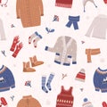 Winter seamless pattern with warm knitted clothes on light background. Backdrop with woolen seasonal clothing and Royalty Free Stock Photo