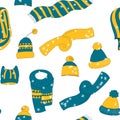 Winter seamless pattern with winter accessories: hats and scarves on white background. Cute vector winter warm knitted Royalty Free Stock Photo