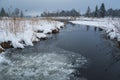 Winter seascape with reeds and ice. Foggy, frosty day in mountain landscape Royalty Free Stock Photo