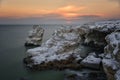 Winter Seascape at sunrise of rocky, frozen coast Royalty Free Stock Photo