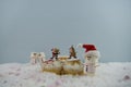 Christmas food photography using marshmallows shaped as snowman and standing in snow with cream sponge fairy cake Royalty Free Stock Photo