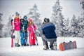 Winter season - father take photographing family on vacation in