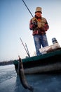 Winter season- Fisherman catch fish on the river Royalty Free Stock Photo