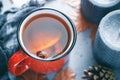 Winter season hot tea in a red ceramic mug Royalty Free Stock Photo