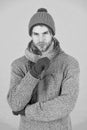 Winter season sale. Hipster knitted winter hat scarf and gloves. Casually handsome. Man handsome unshaven guy wear