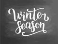 Winter season white lettering text on chalkboard background, illustration. White brush calligraphy for logo, invitation, ba Royalty Free Stock Photo