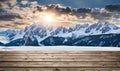 Winter serenity: Empty wooden table with snowy mountain backdrop