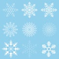 Winter set of white snowflakes isolated on light blue background. Snowflake icons. Snowflakes collection for design Royalty Free Stock Photo