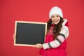 Winter shopping sales. announcement board. very profitable proposition. happy girl empty blackboard. copy space. useful Royalty Free Stock Photo