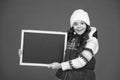 Winter shopping sales. announcement board. very profitable proposition. happy girl empty blackboard. copy space. useful Royalty Free Stock Photo