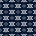 Winter Simple Symmetric Seamless Pattern of White Snowflakes on Dark Blue Backdrop