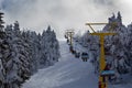 Winter ski resort,ski lift,people skiing. Mountain ski sports concept