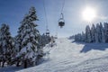 Winter ski resort,ski lift,people skiing. Mountain ski sports concept