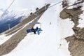 Winter ski slope with skiers, cable car cabin, mountain resort in the Caucasus