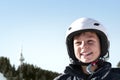 Winter ski vacation in mountains resort, alpine skiing concept. Smiling happy child skier in ski helmet. extreme sport Royalty Free Stock Photo