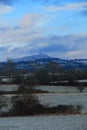 Winter Skies Over A Snowy Glastonbury Tor, Somerset, England Royalty Free Stock Photo