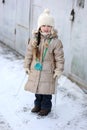 Winter small girl with long hair holds big icicle Royalty Free Stock Photo