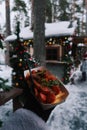 Winter snack sausages on the street in hand, vertical photo. Royalty Free Stock Photo