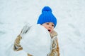 Winter snow and child game. People in snow. Happy winter time for kid. Cute boy in winter clothes. Theme Christmas Royalty Free Stock Photo