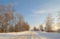 Winter snow covered country road on a sunny day Royalty Free Stock Photo