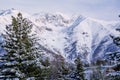 Winter snow-covered forest in the mountains. Mountain peaks covered with snow in winter. Picturesque and gorgeous winter Royalty Free Stock Photo