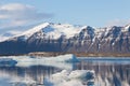 Winter snow covered mountain over Jakulsarlon lagoon Royalty Free Stock Photo