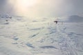 Winter, snow-covered mountains with hikers