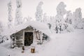 Winter snow covered wood hut. Frozen log cabin in Finland Royalty Free Stock Photo