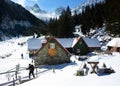 Trekker leaving a chalet in Fagaras mountains. Royalty Free Stock Photo