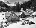 Trekker leaving a chalet in Fagaras mountains. Royalty Free Stock Photo