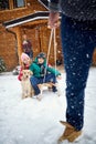 Winter, snow, family sledding at winter time Royalty Free Stock Photo