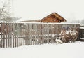 wood fence house building winter snow day Royalty Free Stock Photo