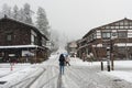 In the winter snow is heavy and the tourist walking on the street with Ancient houses background of Shirakawa-go village at Gifu,