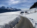 Winter snow idyll along the rural alpine road above the Obertoggenurg valley and on the slopes of the Alpstein mountain range Royalty Free Stock Photo