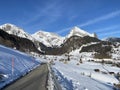 Winter snow idyll along the rural alpine road above the Obertoggenurg valley and on the slopes of the Alpstein mountain range Royalty Free Stock Photo