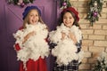 Winter is snow much fun. Small children with artificial snow. Small girls with Christmas decoration. Happy children Royalty Free Stock Photo
