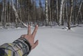 Winter. snow. road. the finger of the hand shows the direction of movement. Royalty Free Stock Photo